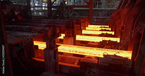 Iron foundry. Continuous casting machine. Production of steel billets. Steel billet moving through the pipeline. Business concept, modern steel production technology