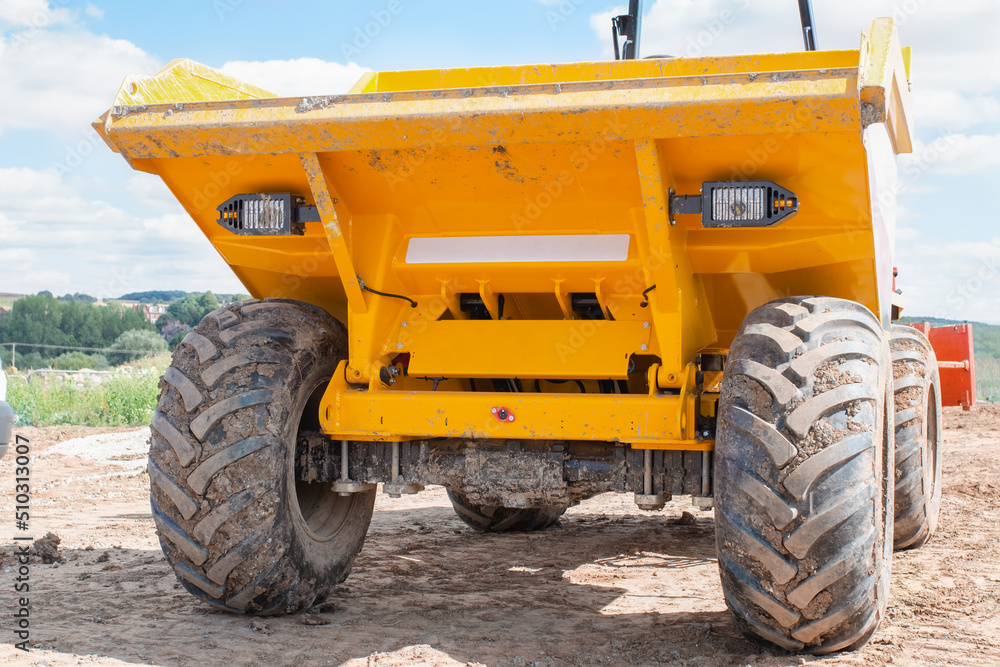 Close up of dumper trClose up of dumper truck tyres on construction site Close up of dumper trClose up of dumper truck tyres on construction site