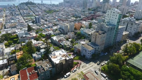 Stunning aerial over San Francisco with downtown and bridge in background photo