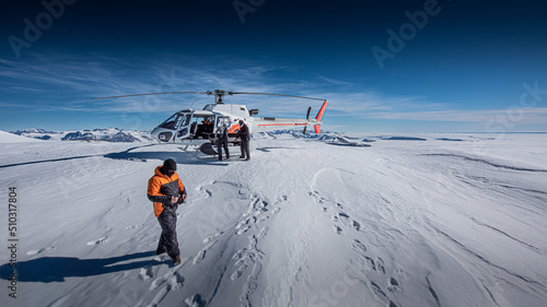 Scientists install experiments in dry valleys, Antarctica, via helicopter