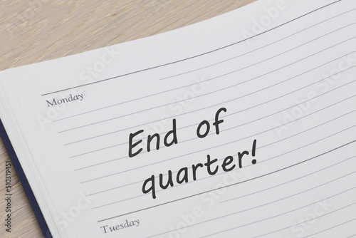 End of quarter reminder note in a diary page photo