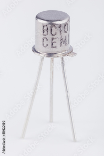Wallpaper Mural Old metal transistor BC107 on white background. Electronic component. Vintage semiconductor device.  Torontodigital.ca