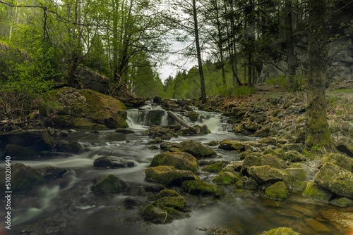 River flowing through a beautiful forest. The photos were taken with a long exposure time © Knut