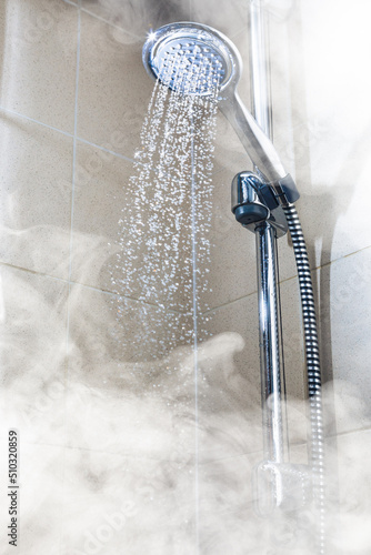 contrast shower with flowing water and steam © nikkytok