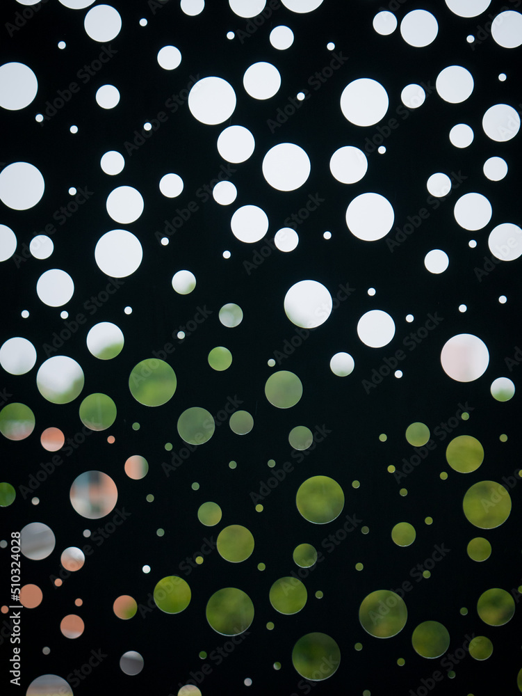 Black Wall with Circular Holes of Different Sizes