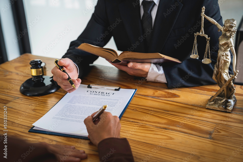 Attorneys or lawyers who are reading the statute of limitations Consultation between male lawyers and business clients, tax and legal and legal services firms. Attorneys or lawyers who are reading the statute of limitations Consultation between male lawyers and business clients, tax and legal and legal services firms.