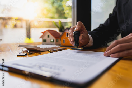 Wall Mural Real estate agents stamp their approval to buy and sell homes