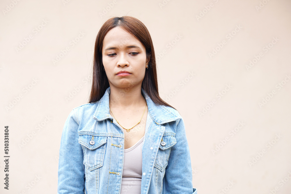 Asian women look unhappy, stressed out of work Asian women look unhappy, stressed out of work