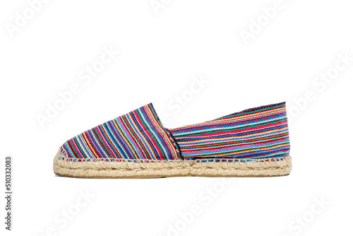 STYLISH MULTICOLOR STRIPED ESPADRILLE ISOLATED ON WHITE BACKGROUND.
SUMMER FOOTWEAR FASHION TRENDS. COMFORTABLE SHOES CONCEPT. photo