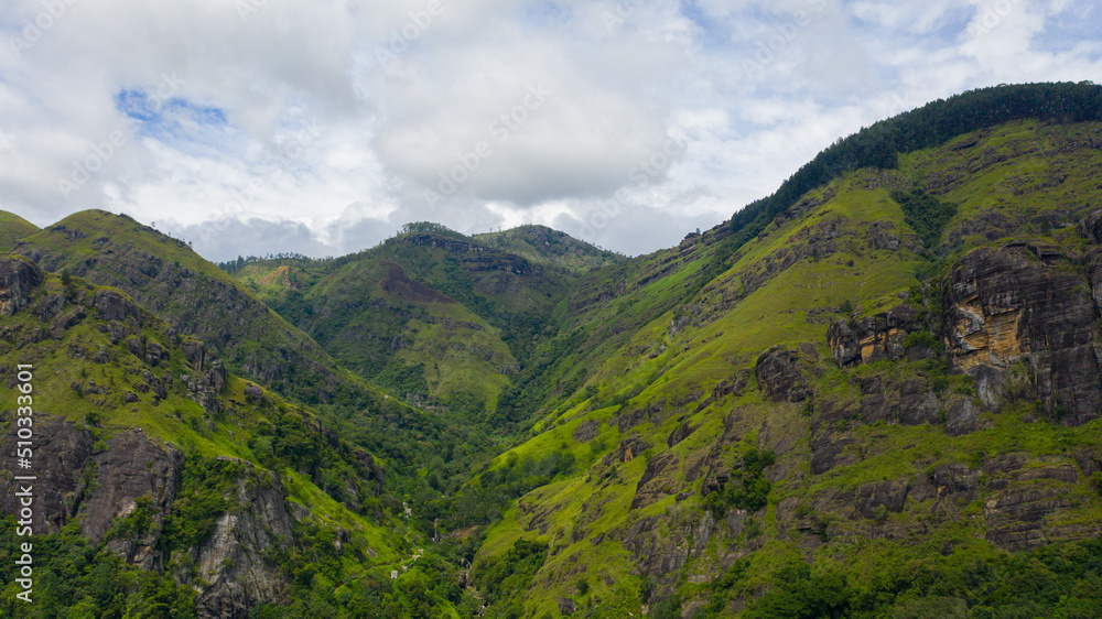 Naklejka premium Aerial view of Mountains with rainforest and clouds. Sri Lanka.