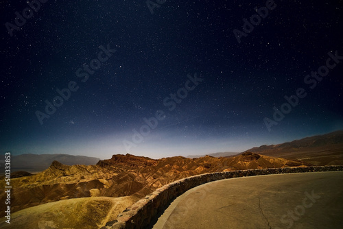 Stars over Death Valley desert mountains at Zabriskie Point