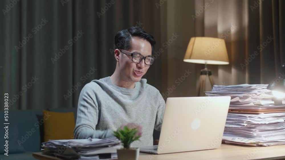 Asian Man Having Video Call On Laptop While Working With Documents At Home
Asian Man Having Video Call On Laptop While Working With Documents At Home