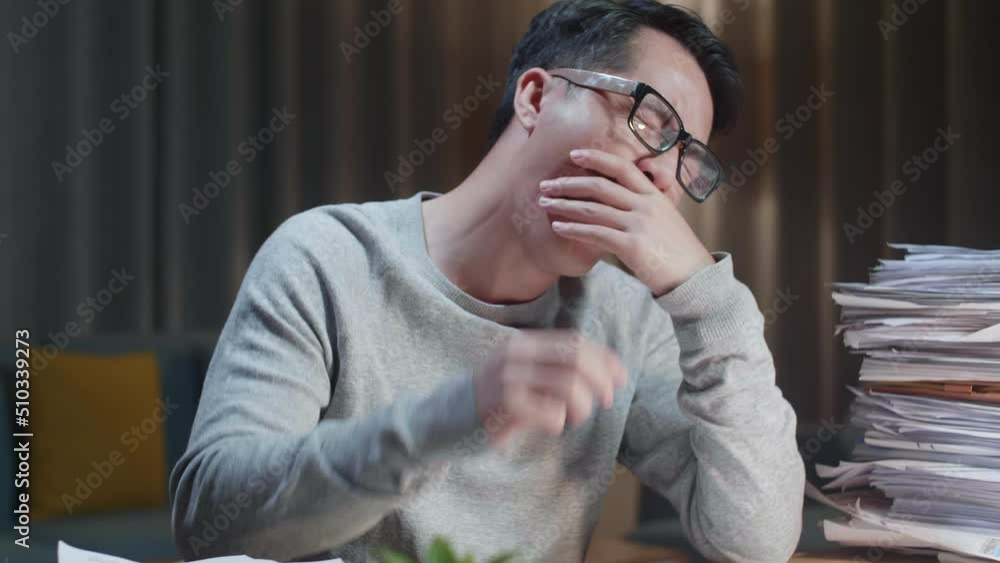 Close Up Of Tired Asian Man Yawning While Working Hard With Documents At Home
Close Up Of Tired Asian Man Yawning While Working Hard With Documents At Home