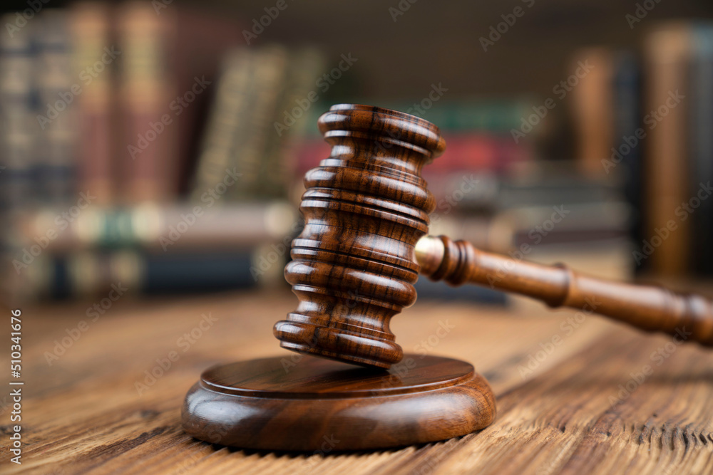 Lawyer office. Gavel and legal books on the judge rustic wooden desk. Lawyer office. Gavel and legal books on the judge rustic wooden desk.