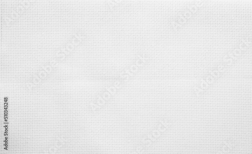 Fabric canvas woven texture background in pattern light white color blank. Natural gauze linen, carpet wool and cotton cloth material.