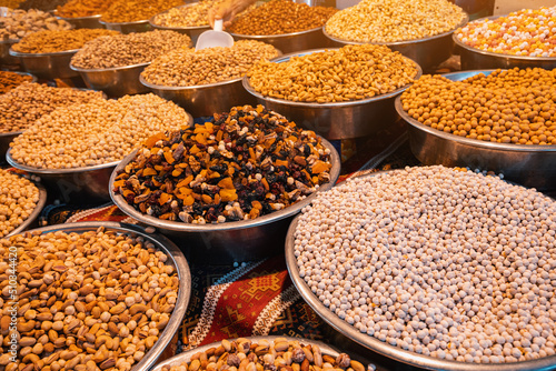 Roasted chickpeas, dried fruits and other nuts on the farmers counter at the local market or oriental bazaar