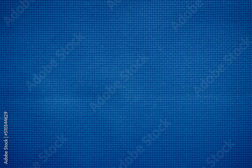 Closeup of blue fabric texture for background used. Pattern blue dark denim, linen, natural cotton satin textile textured cloth burlap seamless blank. 
