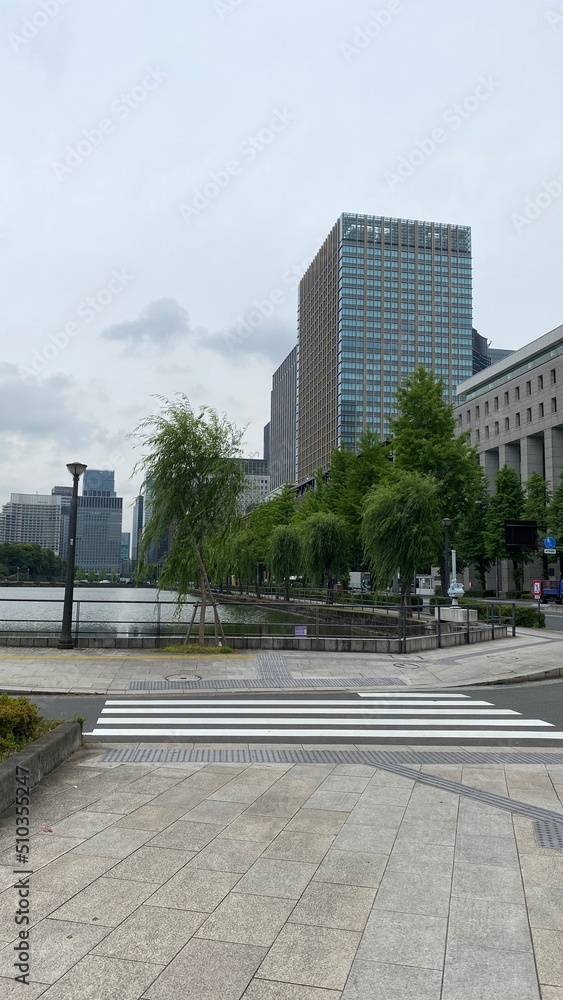 The street corner at the Imperial Place of Tokyo Japan, the canal stretching around the property with city buildings, year 2022 June 11th
