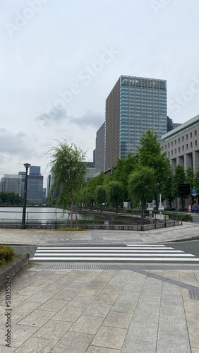 The street corner at the Imperial Place of Tokyo Japan, the canal stretching around the property with city buildings, year 2022 June 11th  © KAYO SUGIUCHI