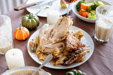high angle view of thanksgiving table after feast, leftovers and dirty dishes
