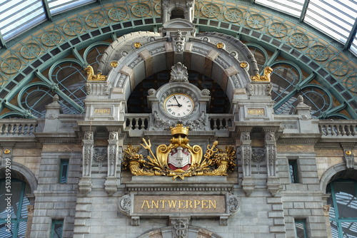 Historical ornaments and clock at Antwerp Centraal Station.