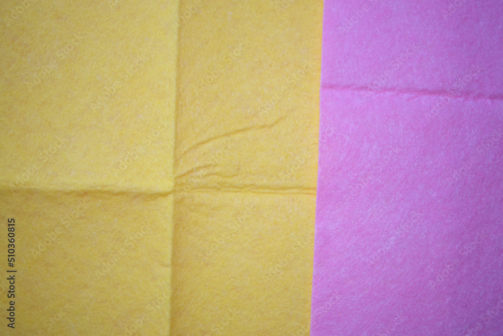 Fototapeta premium Yellow and pink dust cloth texture.