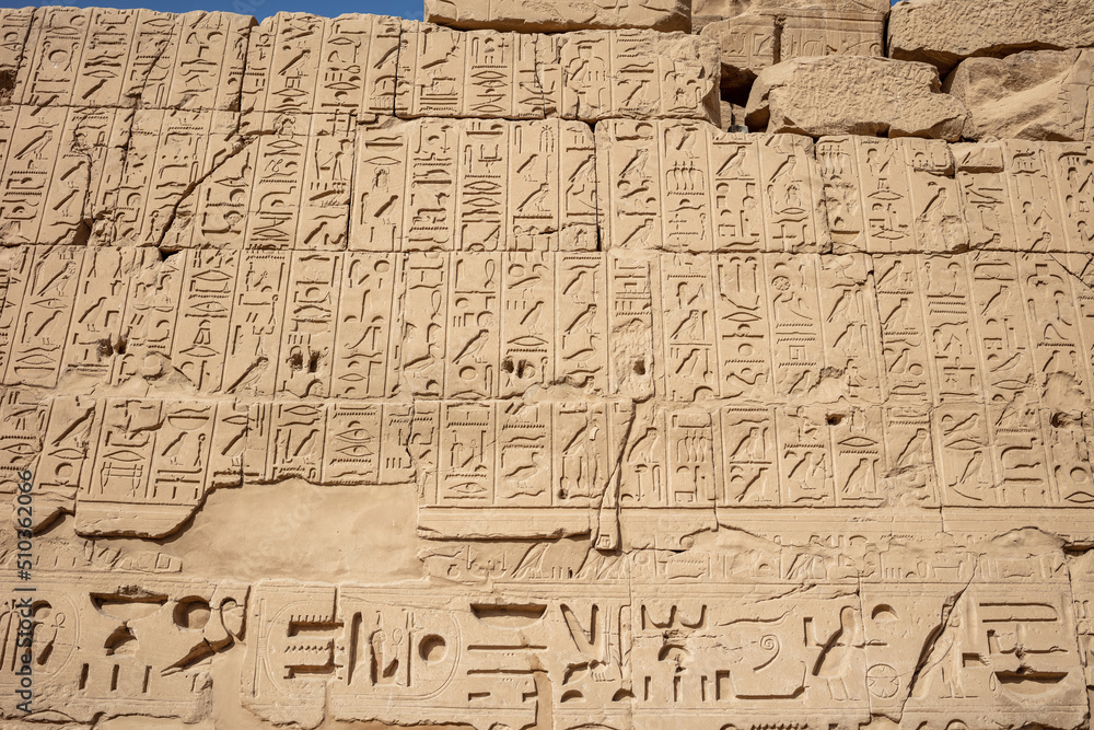 Different hieroglyphs on the walls and columns in the Karnak temple. Karnak temple is the largest complex in ancient Egypt. Different hieroglyphs on the walls and columns in the Karnak temple. Karnak temple is the largest complex in ancient Egypt.