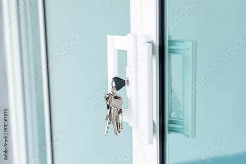 Close-up of the key ring plugged into the glass door.