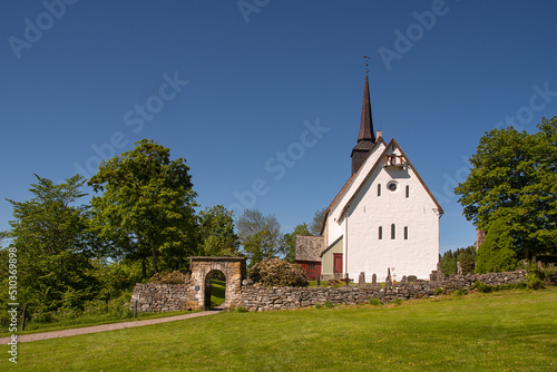 Tingvoll church, Nordmørsdomen, Norway. This church is a white stone church from 1180. Beautiful surroundings.  photo