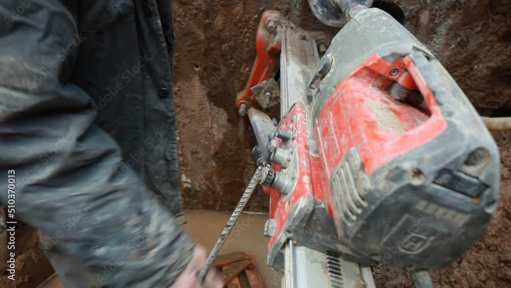 drilling a hole in a concrete pipe with a diamond tool drilling a hole in a concrete pipe with a diamond tool