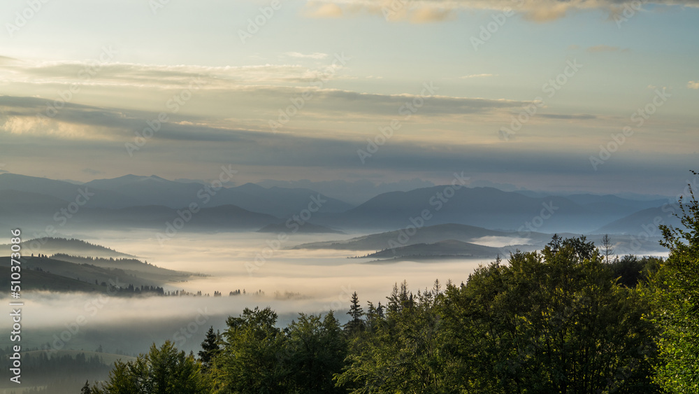Dawn over the mountains and the birth of clouds from the fog.