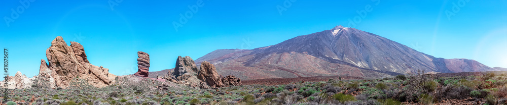 Panoramic view of The National Park of Las Canadas del Teide in Tenerife Islands with unreal volcanic rock formations, caused by copper deposits.