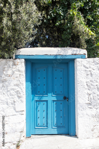 Blue wooden door. Vintage gate of a Mediterranean villa.