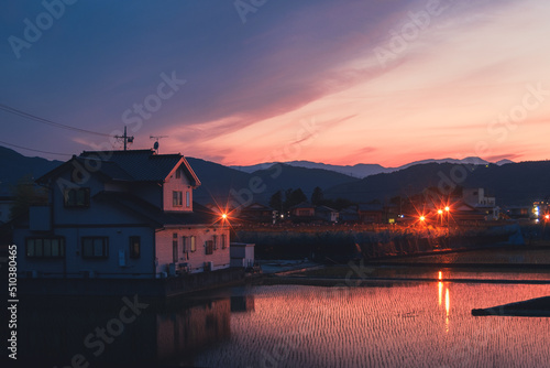 The orange purple sunset in the Japanese village 