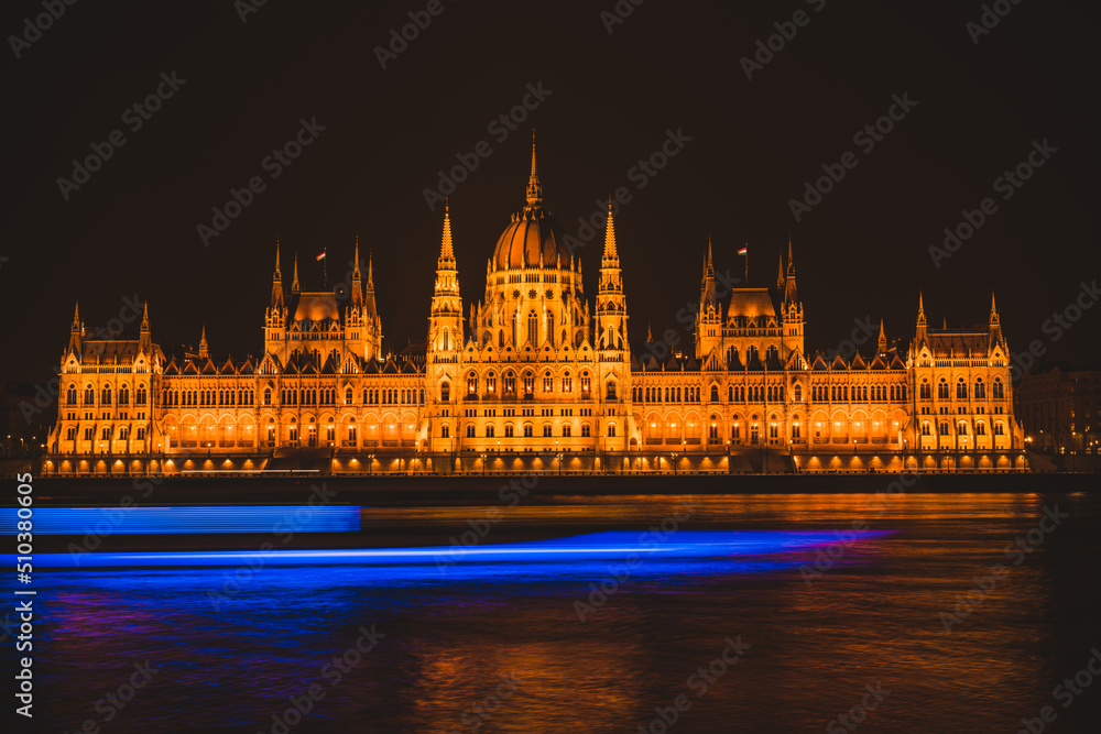 Hungarian parliament building from across the Danube river at night Budapest Hungary