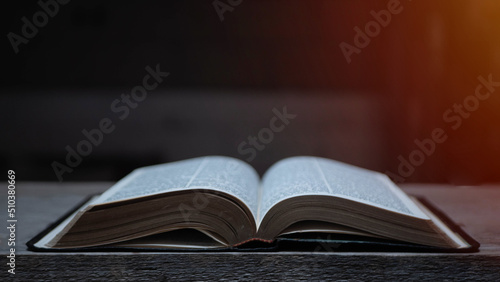 Open Bible on a Slate Tabletop with Customizable Space to Add Text