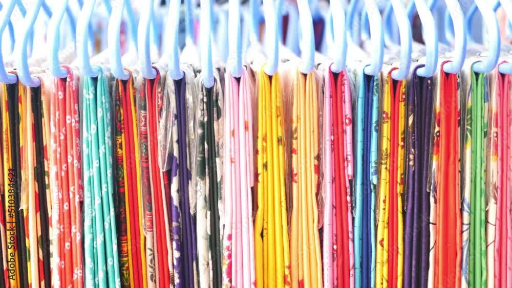 close up of many asian cloths display for sale close up of many asian cloths display for sale