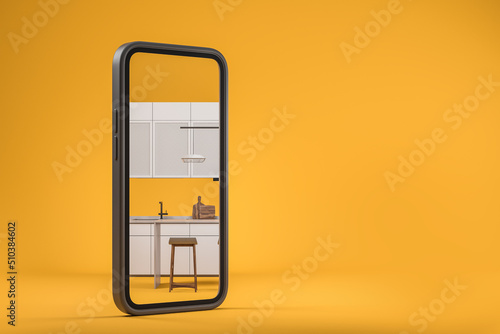 Smartphone and kitchen interior on the screen. Copy space