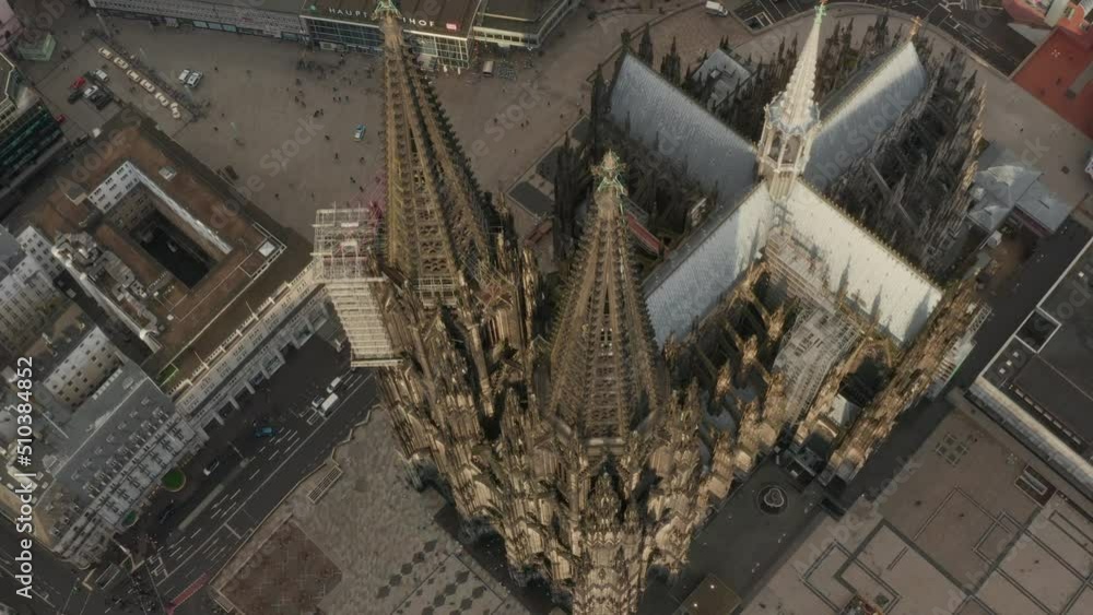 High angle view of gothic cathedral in city. Amazing ascending shot of historic landmark and popular tourist destination. Cologne, Germany High angle view of gothic cathedral in city. Amazing ascending shot of historic landmark and popular tourist destination. Cologne, Germany