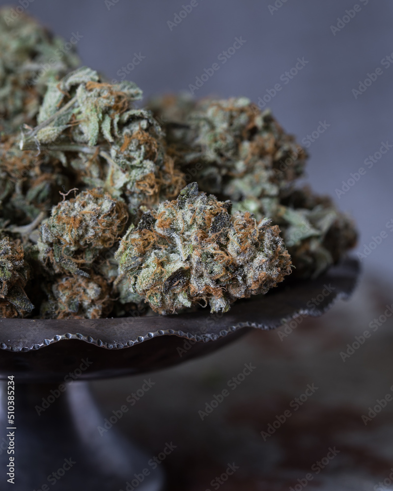 Cannabis buds dried and trimmed. Marijuana buds photographed in natural light. Close up with lots of detail. 