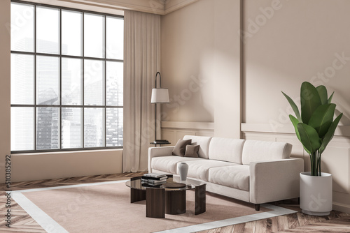 Light living room interior with sofa and coffee table, panoramic window