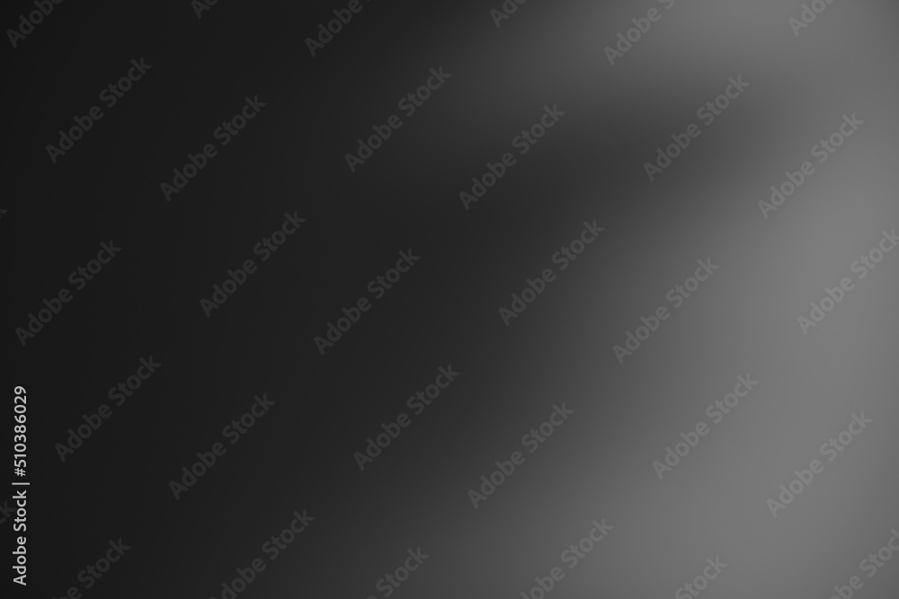 Dark black and gray blurred gradient background has a little abstract light. Dark black and gray blurred gradient background has a little abstract light.