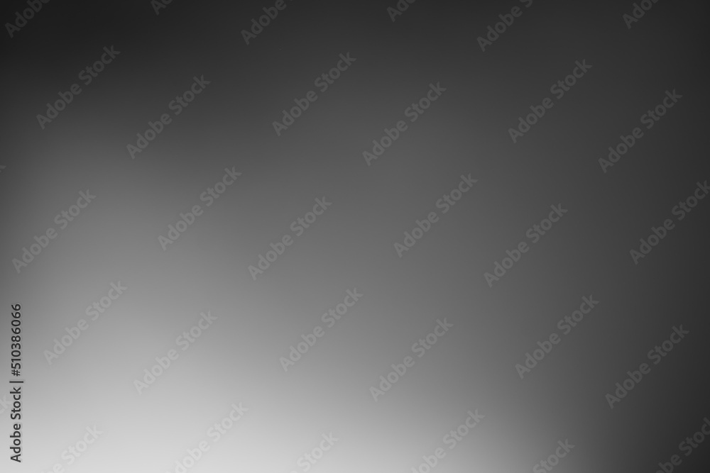 Dark black and gray blurred gradient background has a little abstract light. Dark black and gray blurred gradient background has a little abstract light.