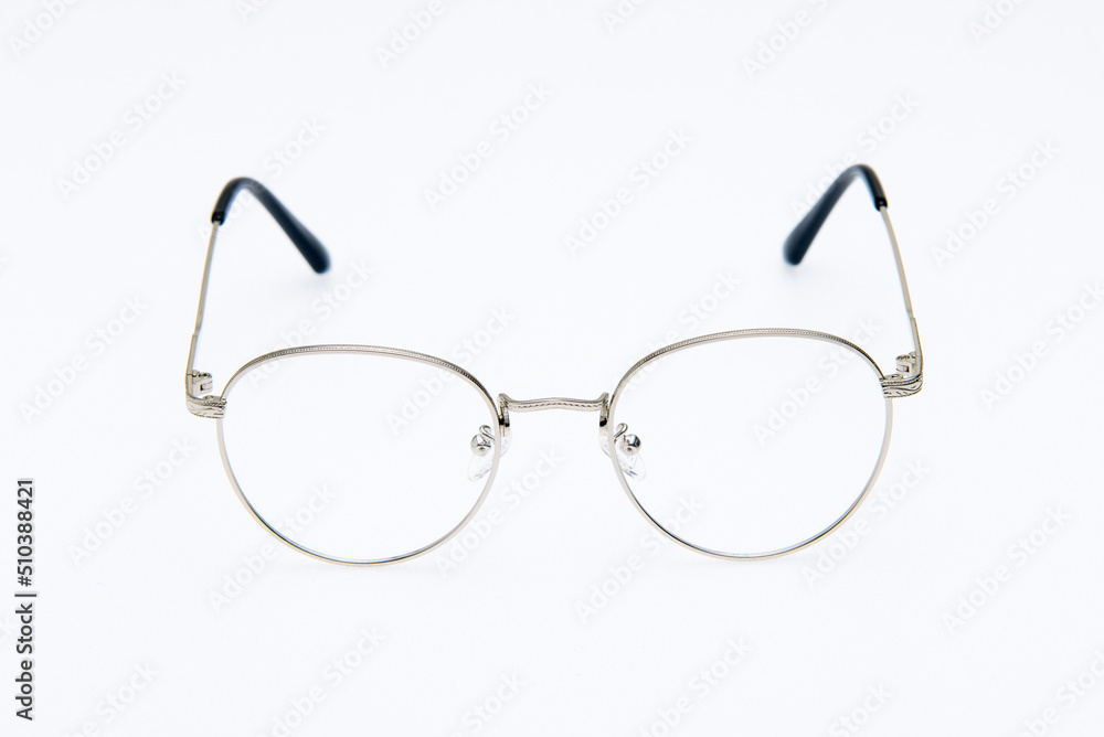 Fototapeta premium Fashion sunglasses silver frames on white background.