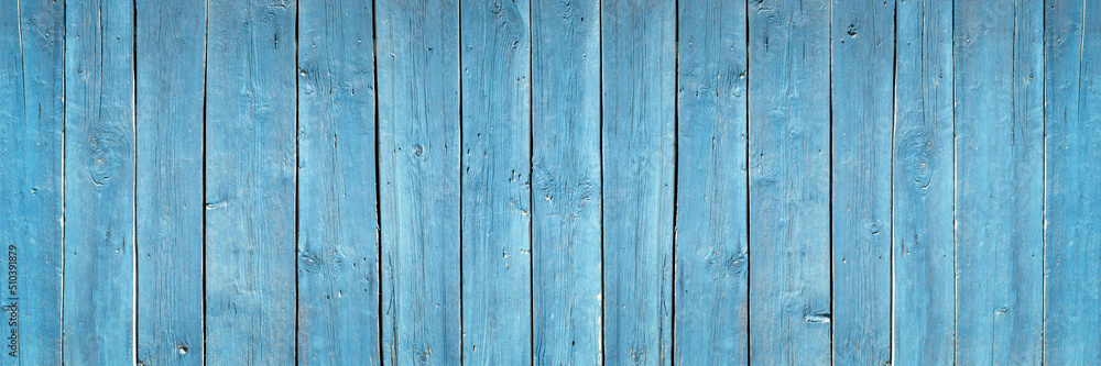 blue fence made of old wooden boards, texture and structure of wooden boards close-up banner, background for design blue fence made of old wooden boards, texture and structure of wooden boards close-up banner, background for design