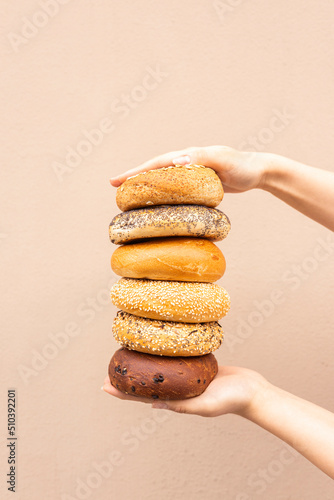 many different bagels in a stack