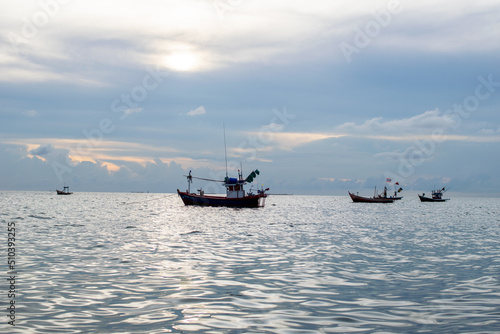 fishing boat on the sea with blue sky background