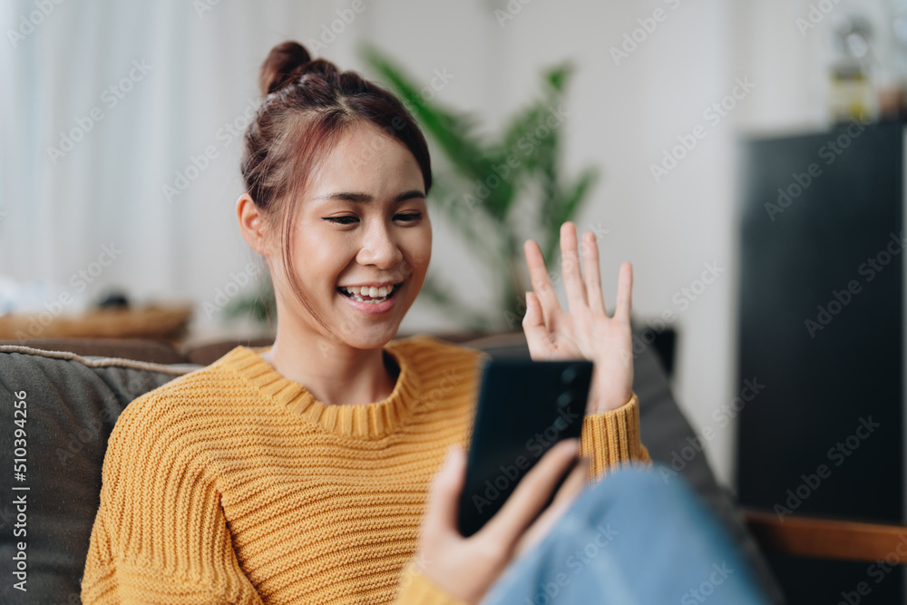 Latin girl taking a picture with her mobile phone. Teenager in a video call  with her