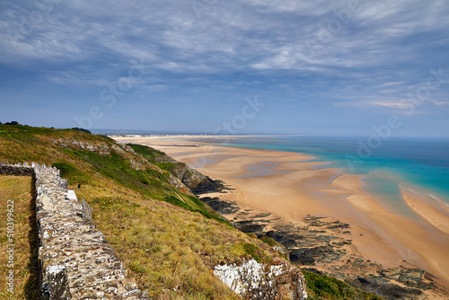 Image of Carteret Plage with the headland in the foreground. Normandy, France. photo