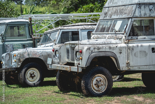 Old rusty cars for safari in the jungle of Africa